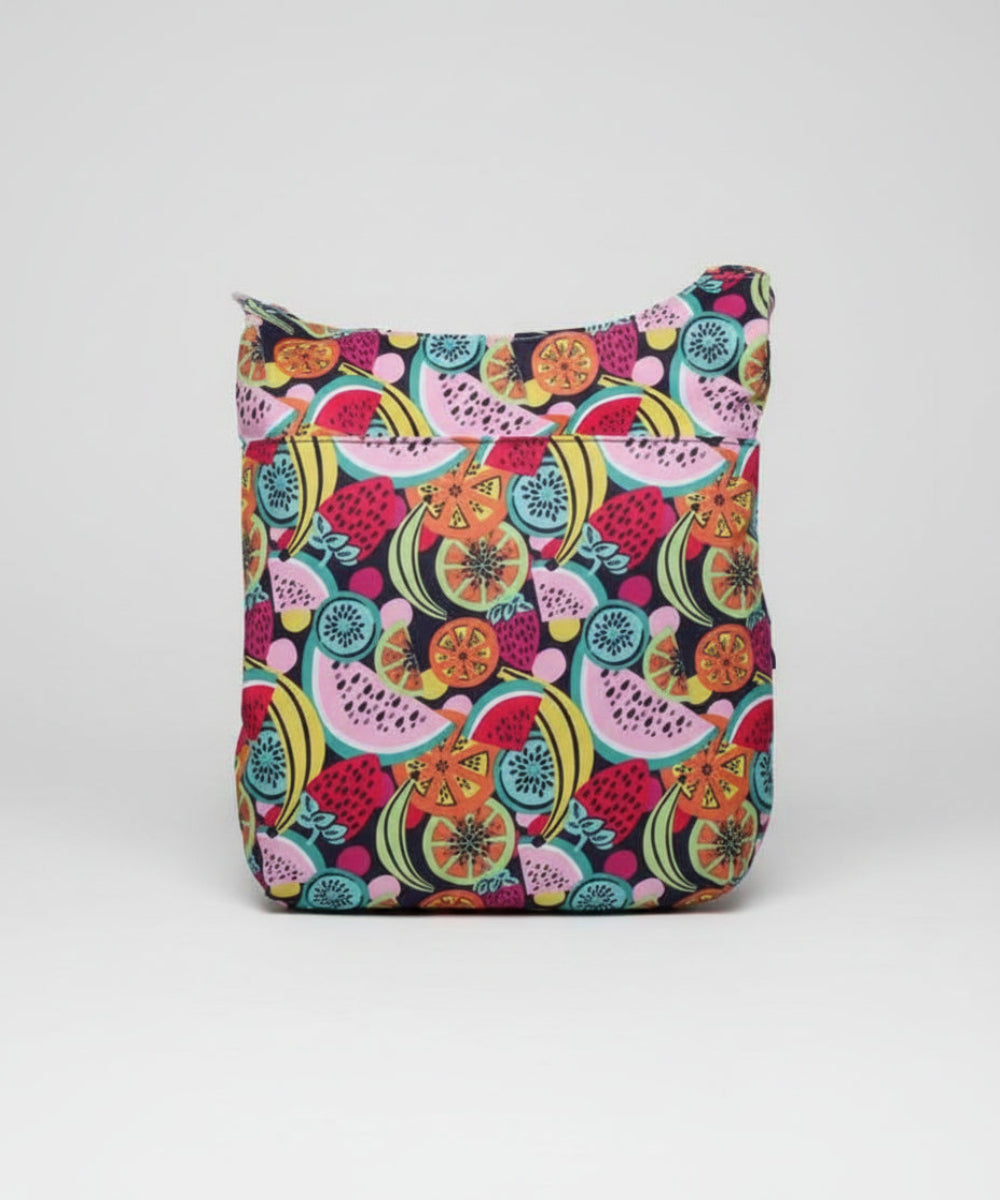 Colorful fruit patterned bag on a dark background