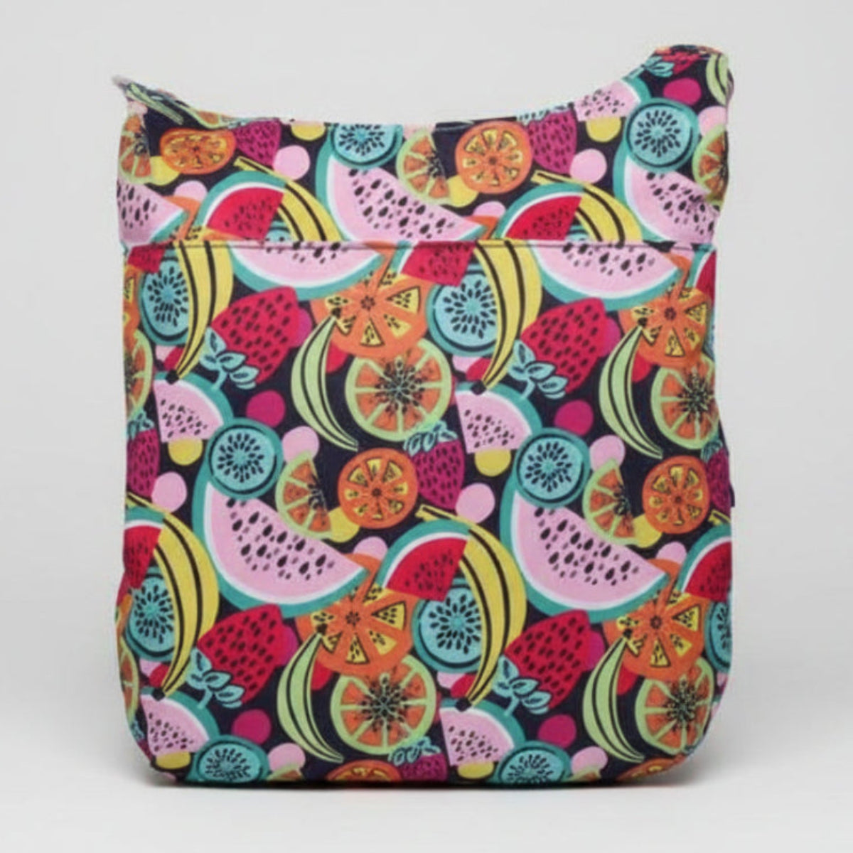 Colorful fruit patterned bag on a dark background
