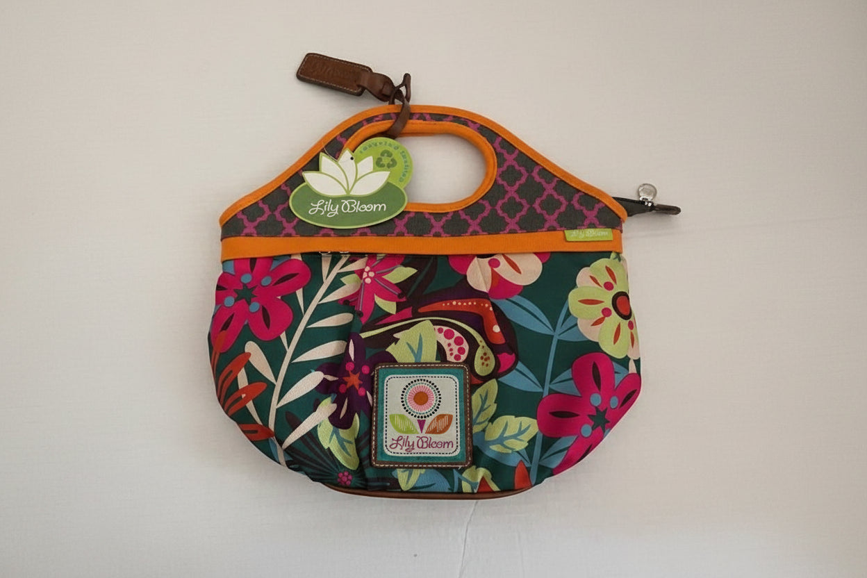 Colorful floral-patterned handbag with 'Lilly Bloom' branding.
