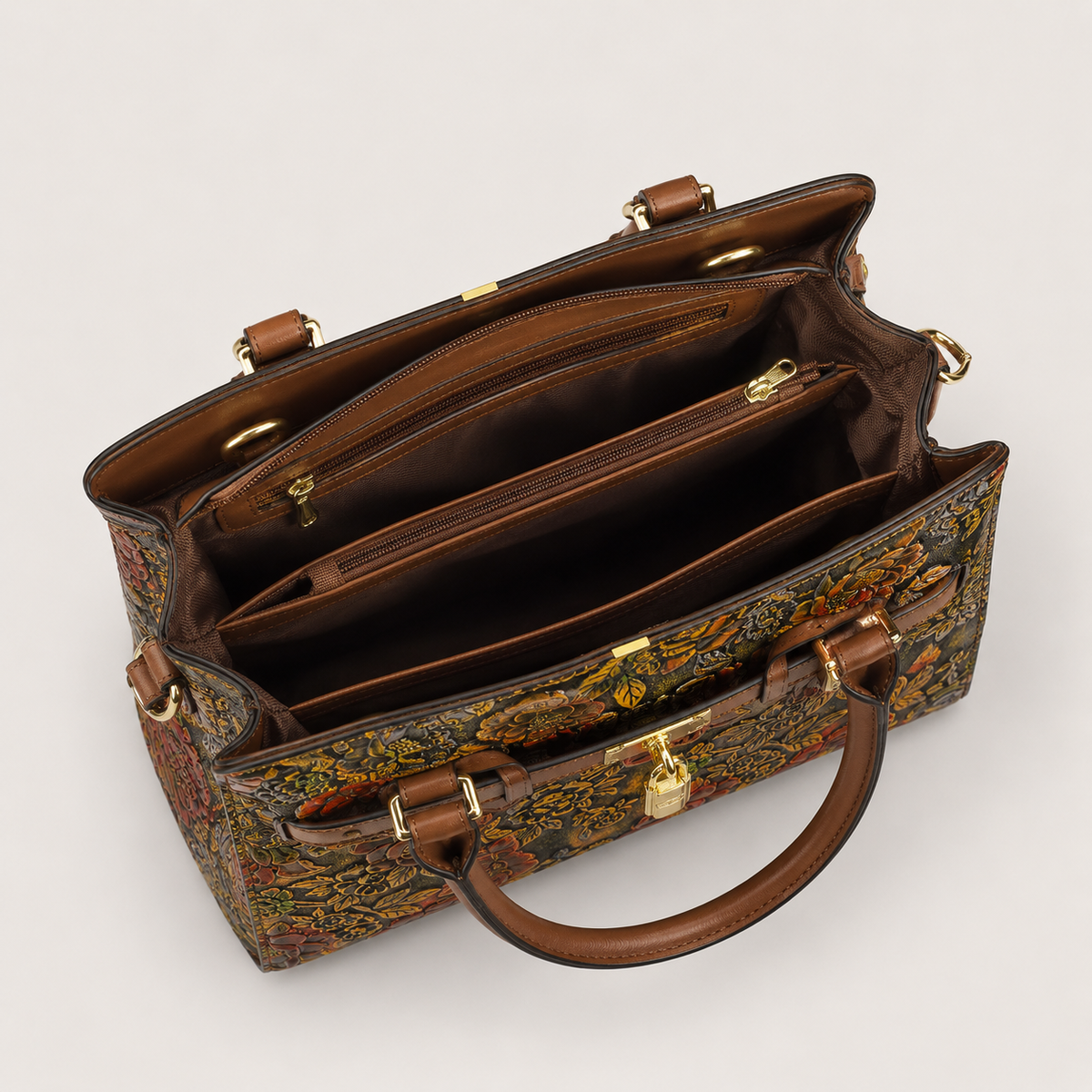 Interior of floral vegan leather handbag with multiple zippered compartments