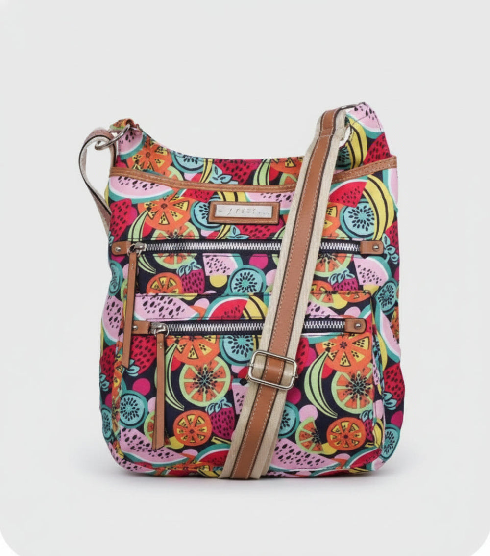 Colorful fruit-patterned crossbody bag with a visible brand label.